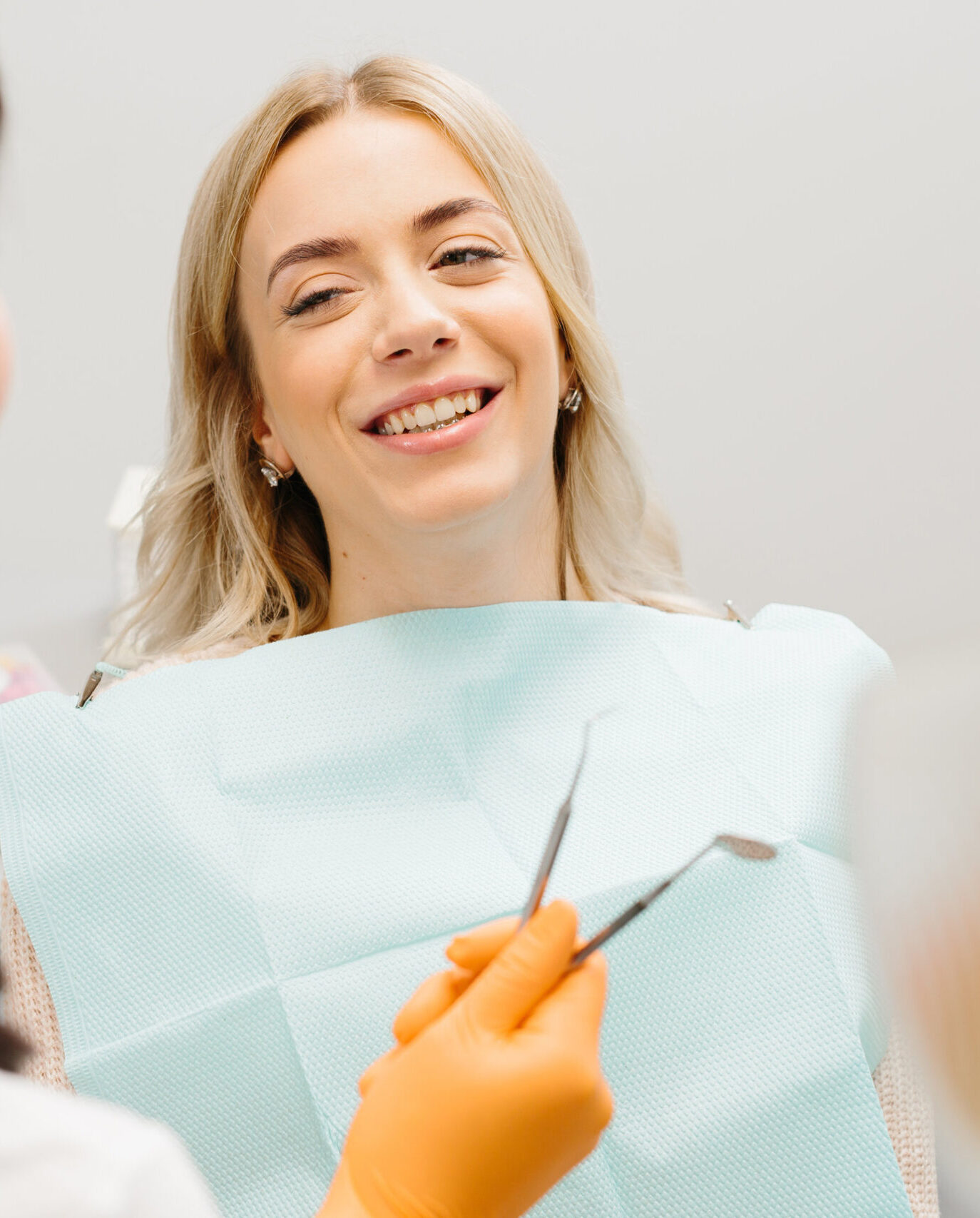 Doctor talking with her patient. Dentist concept