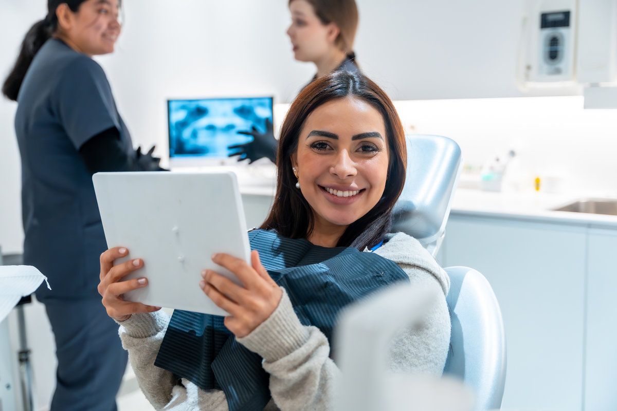 Smiling woman at dental appointment.