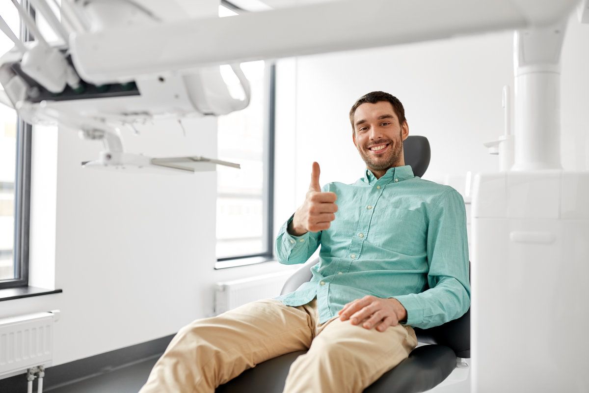 Smiling man at dental clinic