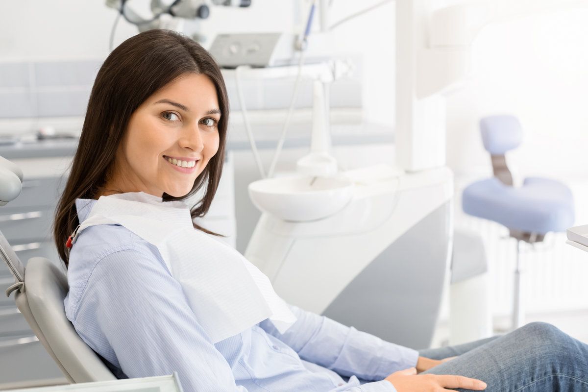 Smiling woman in dental clinic chair