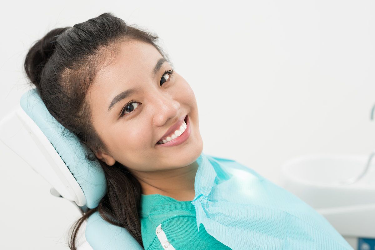 Woman smiling at dental clinic
