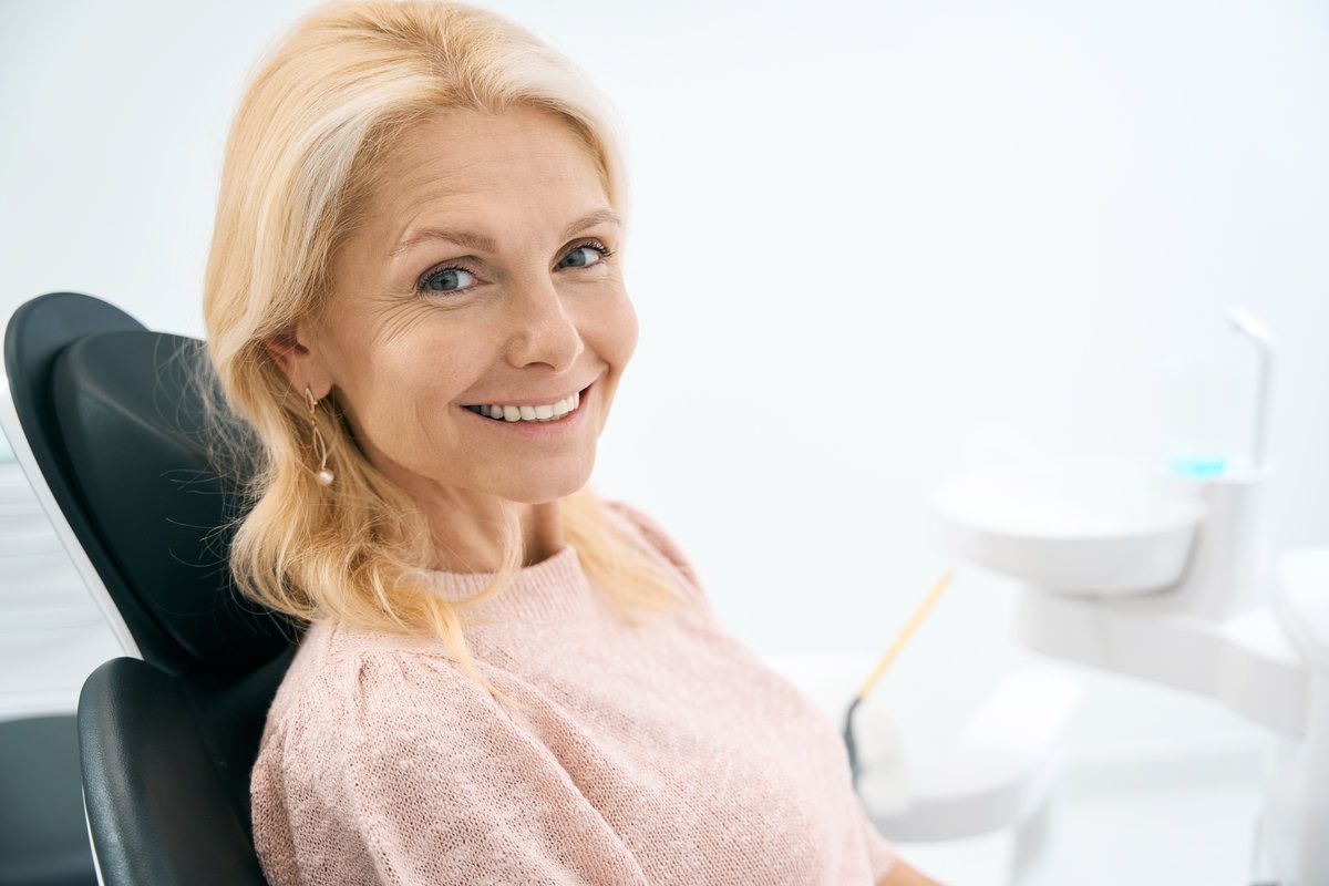Smiling woman in dental chair