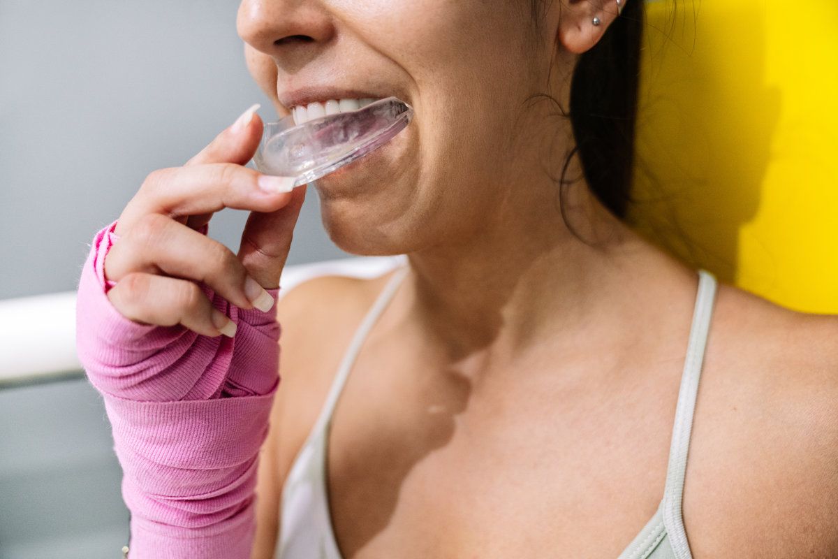 Woman preparing for boxing training.